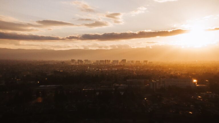 Beautiful aerial view of San Jose skyline during a stunning golden sunset.