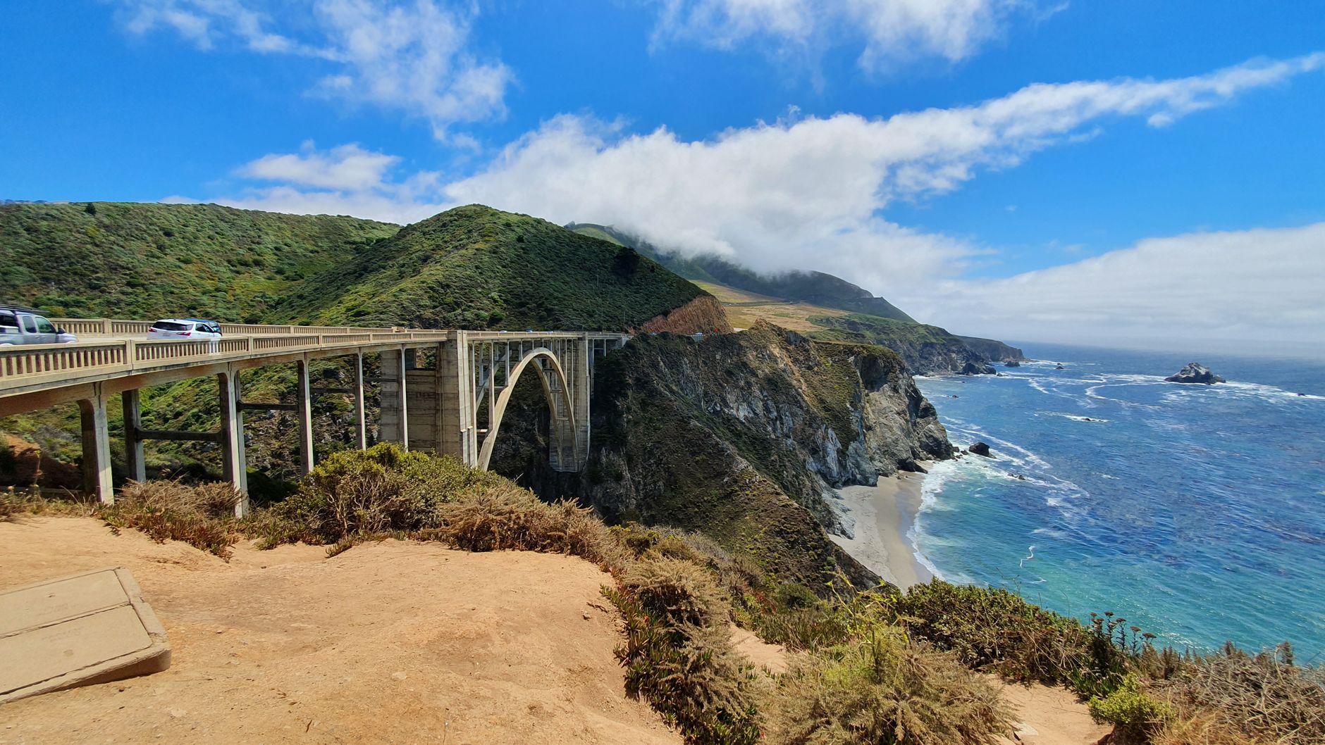 Stunning view of Bixby Creek Bridge against coastal cliffs and ocean in Big Sur, California.